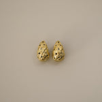 eztli earrings, gold woven texture in a teardrop shape