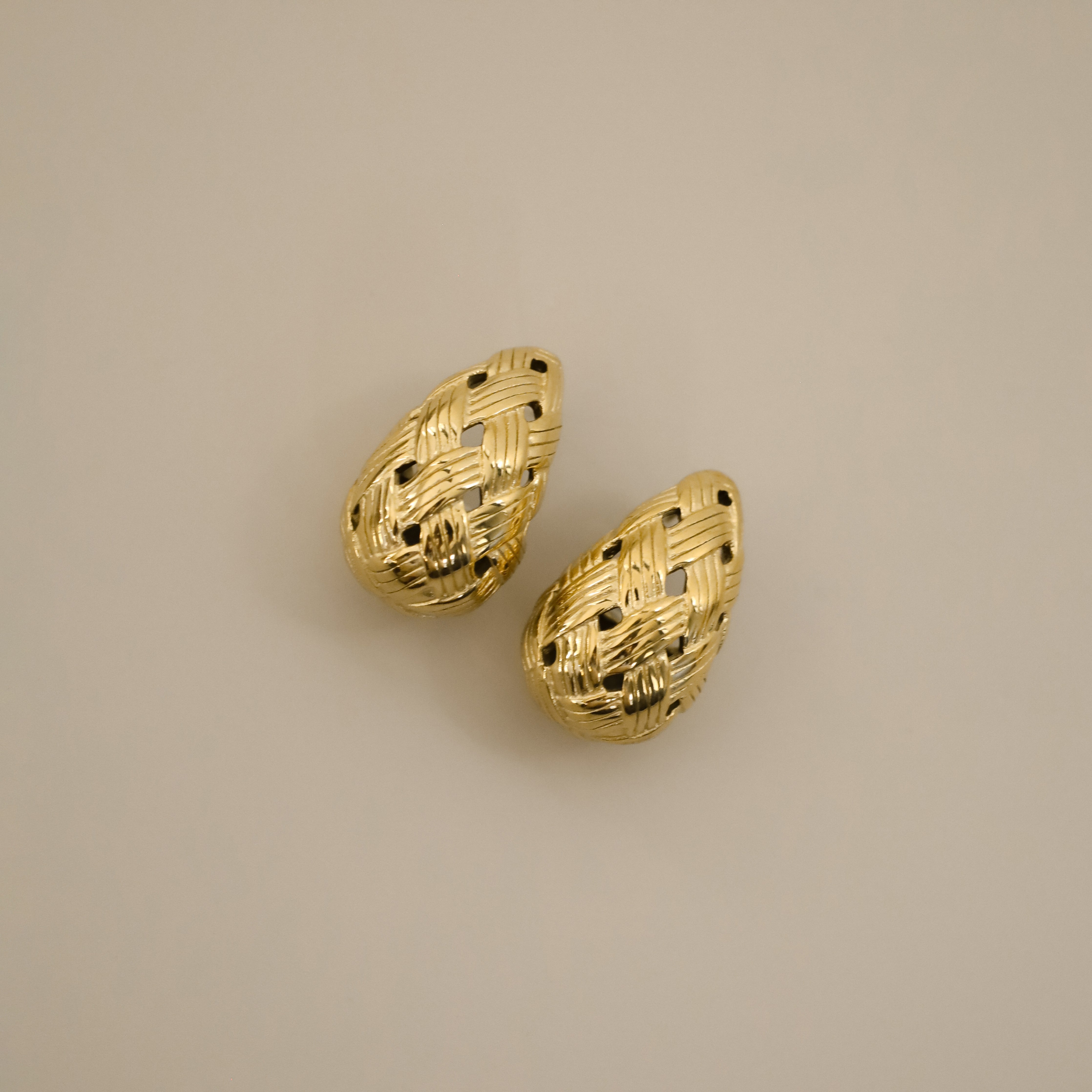 eztli earrings, gold woven texture in a teardrop shape
