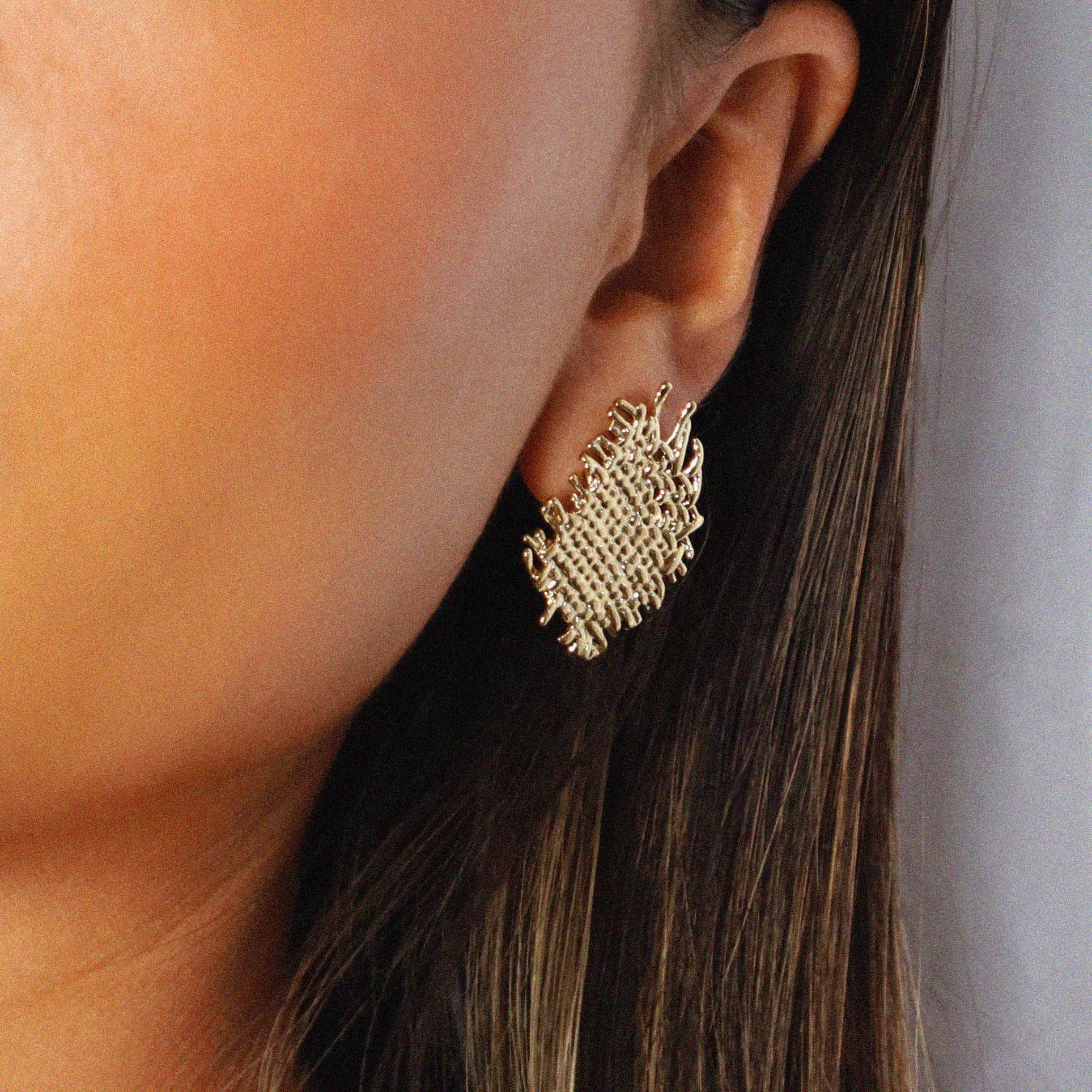 eddard earrings, gold textured design that resembles woven strands