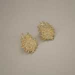 eddard earrings, gold textured design that resembles woven strands