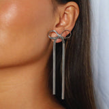 verrmae, eilah silver earrings, long bow earrings, 3mm snake chain bow earrings, verrmae, earrings, rhodium plated jewellery, rhodium plated earrings, rhodium plated stainless steel, rhodium plated, waterproof jewellery, vintage inspired jewellery, vintage inspired earrings, jewellery melbourne, jewellery, statement jewellery, everyday jewellery, silver jewellery, silver earrings, silver plated earrings, silver plated jewellery, jewellery australia