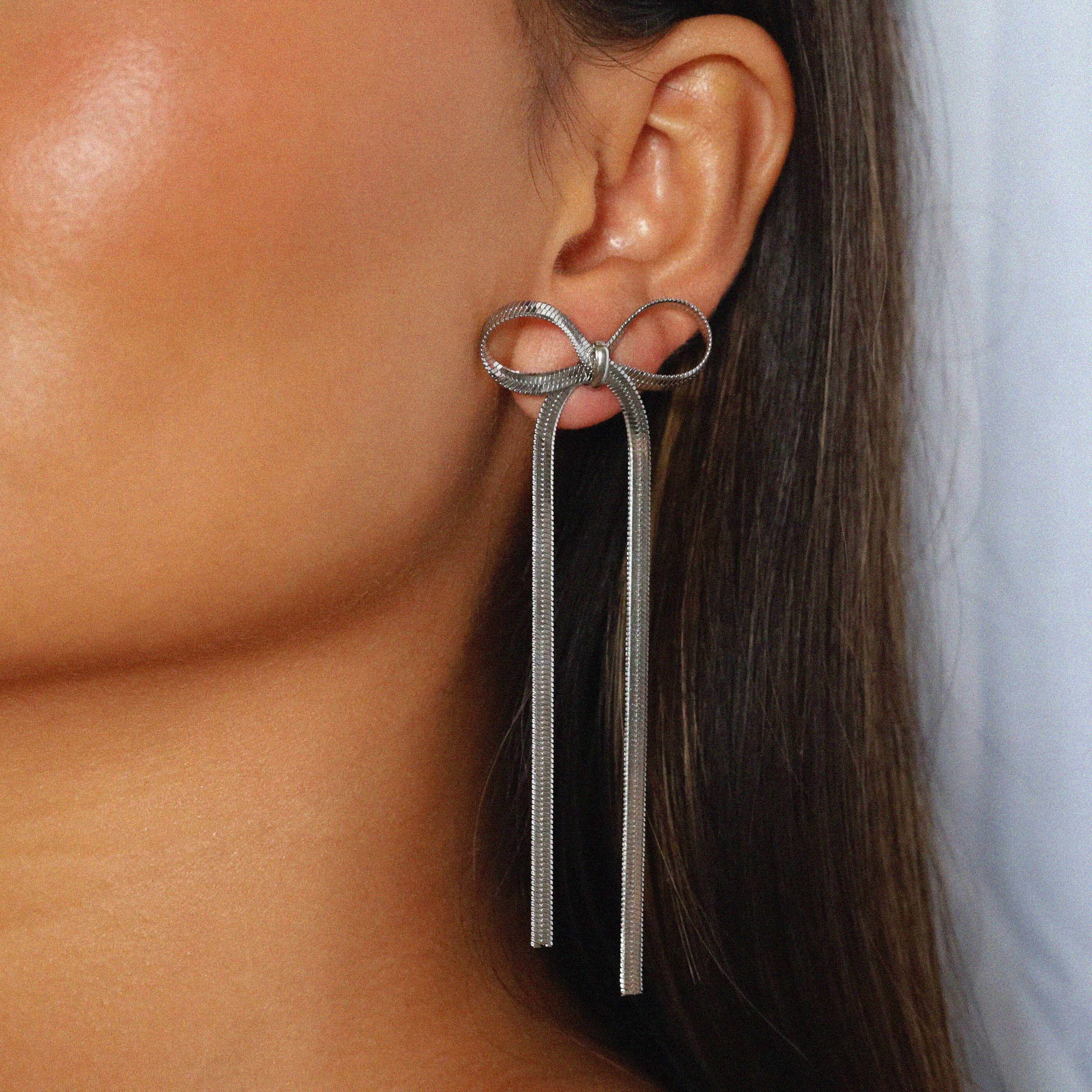 verrmae, eilah silver earrings, long bow earrings, 3mm snake chain bow earrings, verrmae, earrings, rhodium plated jewellery, rhodium plated earrings, rhodium plated stainless steel, rhodium plated, waterproof jewellery, vintage inspired jewellery, vintage inspired earrings, jewellery melbourne, jewellery, statement jewellery, everyday jewellery, silver jewellery, silver earrings, silver plated earrings, silver plated jewellery, jewellery australia