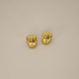 ewadi earrings, gold, distinctive staggered, layered design with a ribbed texture that wraps around in a curved, dome-like shape