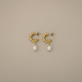 eharli earrings, twisted gold hoop design accented by a single dangling freshwater pearl