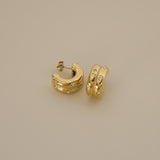 elidi earrings, gold bold double hoop earrings adorned with delicate, sparkling Cubic Zirconia stones sprinkled throughout