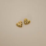 elisma earrings, gold heart-shaped design and thick ribbed detailing