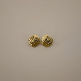 eppera earrings, gold circular design with a beautifully ribbed pattern that swirls around the surface