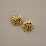 eppera earrings, gold circular design with a beautifully ribbed pattern that swirls around the surface