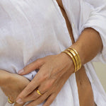 brandi bangle, gold open cuff bangle with triple band design pictured on models wrist