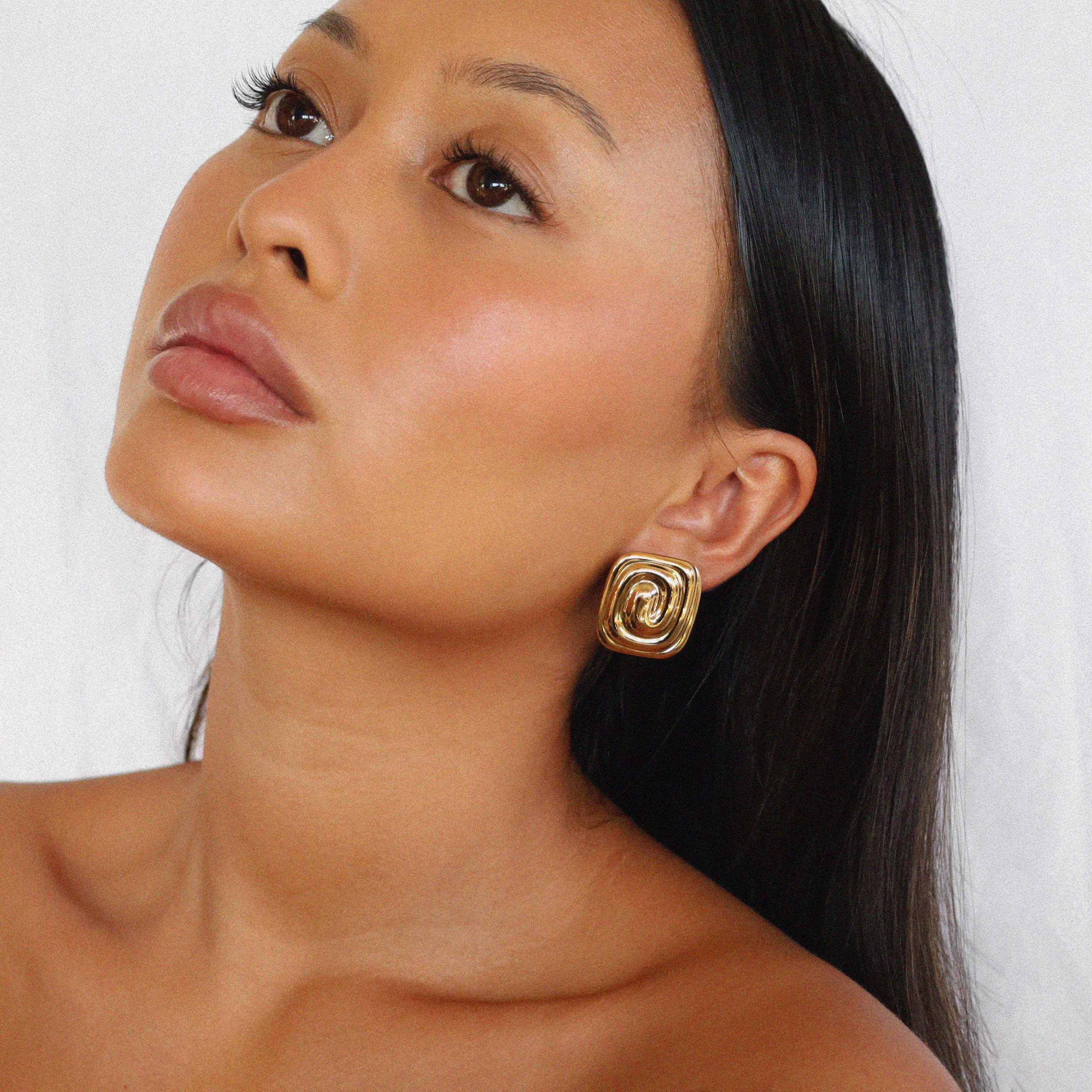 ederne earrings, gold bold square design with a unique, layered spiral pattern