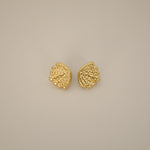 elestri earrings, gold earrings, shell-like shape with a hammered texture