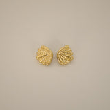 elestri earrings, gold earrings, shell-like shape with a hammered texture