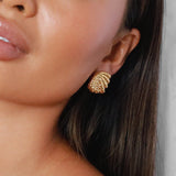 elestri earrings, gold earrings, shell-like shape with a hammered texture