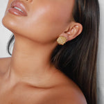 elestri earrings, gold earrings, shell-like shape with a hammered texture