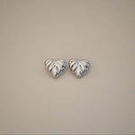 elisma earrings, silver heart-shaped design and thick ribbed detailing