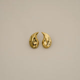 elwood gold earrings, small stud earrings featuring a curved teardrop shape with an irregular texture