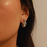 elwood silver earrings, small stud earrings featuring a curved teardrop shape with an irregular texture