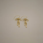 erkinne gold earrings, delicate bow design with dangling ribbons