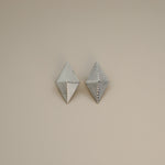 erlea earrings, silver bold diamond shape with a layered, ridged design