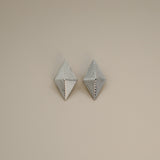 erlea earrings, silver bold diamond shape with a layered, ridged design