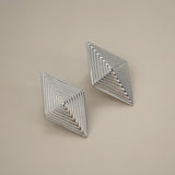 erlea earrings, silver bold diamond shape with a layered, ridged design