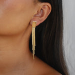 ermias earrings, gold rectangular stud with cascading, delicate strands