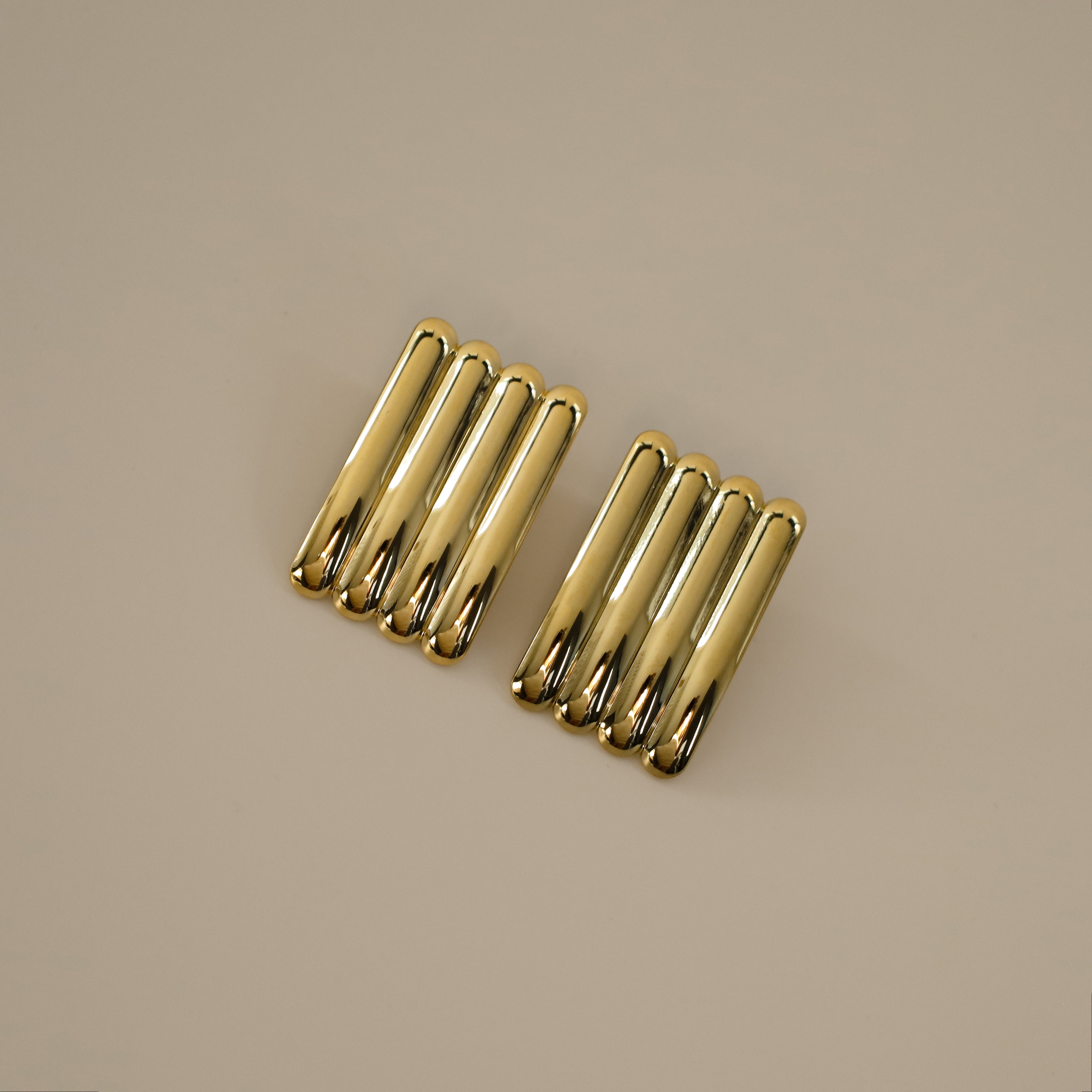 ewella earrings, gold rectangular-shaped statement earrings that feature a thick vertical ribbed design