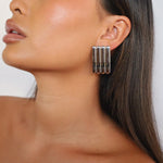 ewella earrings, silver rectangular-shaped statement earrings that feature a thick vertical ribbed design