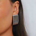 ewella earrings, silver rectangular-shaped statement earrings that feature a thick vertical ribbed design