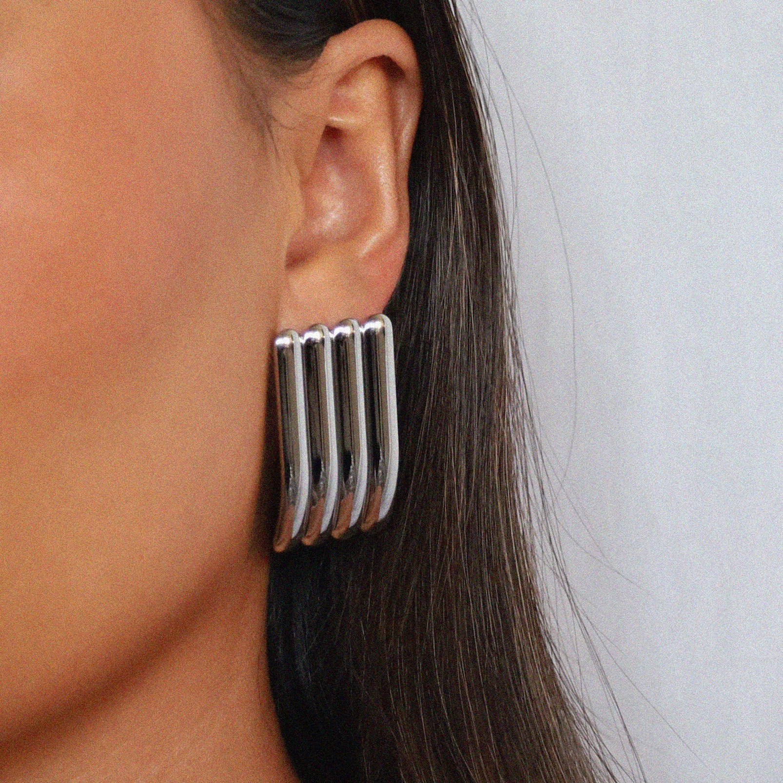 ewella earrings, silver rectangular-shaped statement earrings that feature a thick vertical ribbed design