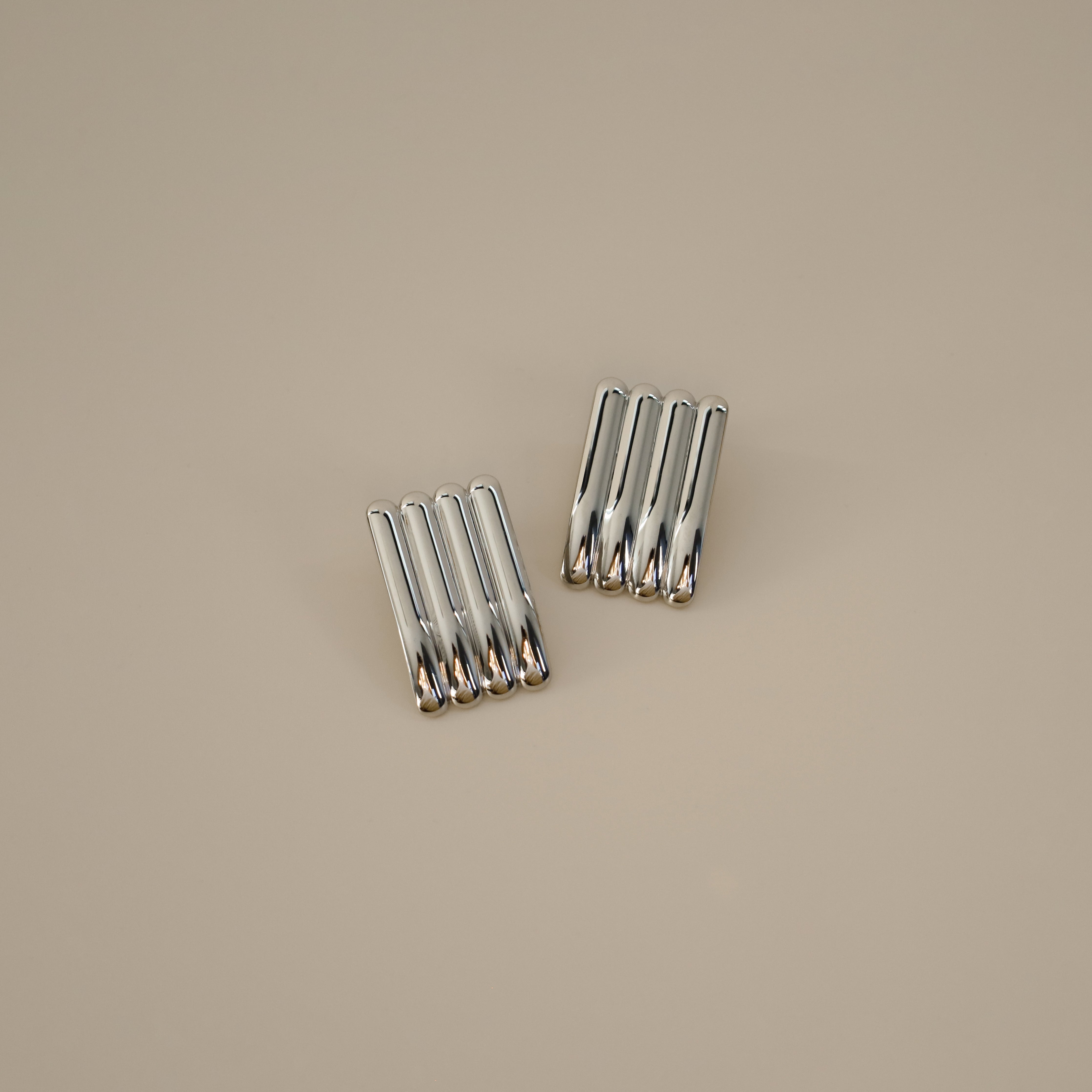 ewella earrings, silver rectangular-shaped statement earrings that feature a thick vertical ribbed design