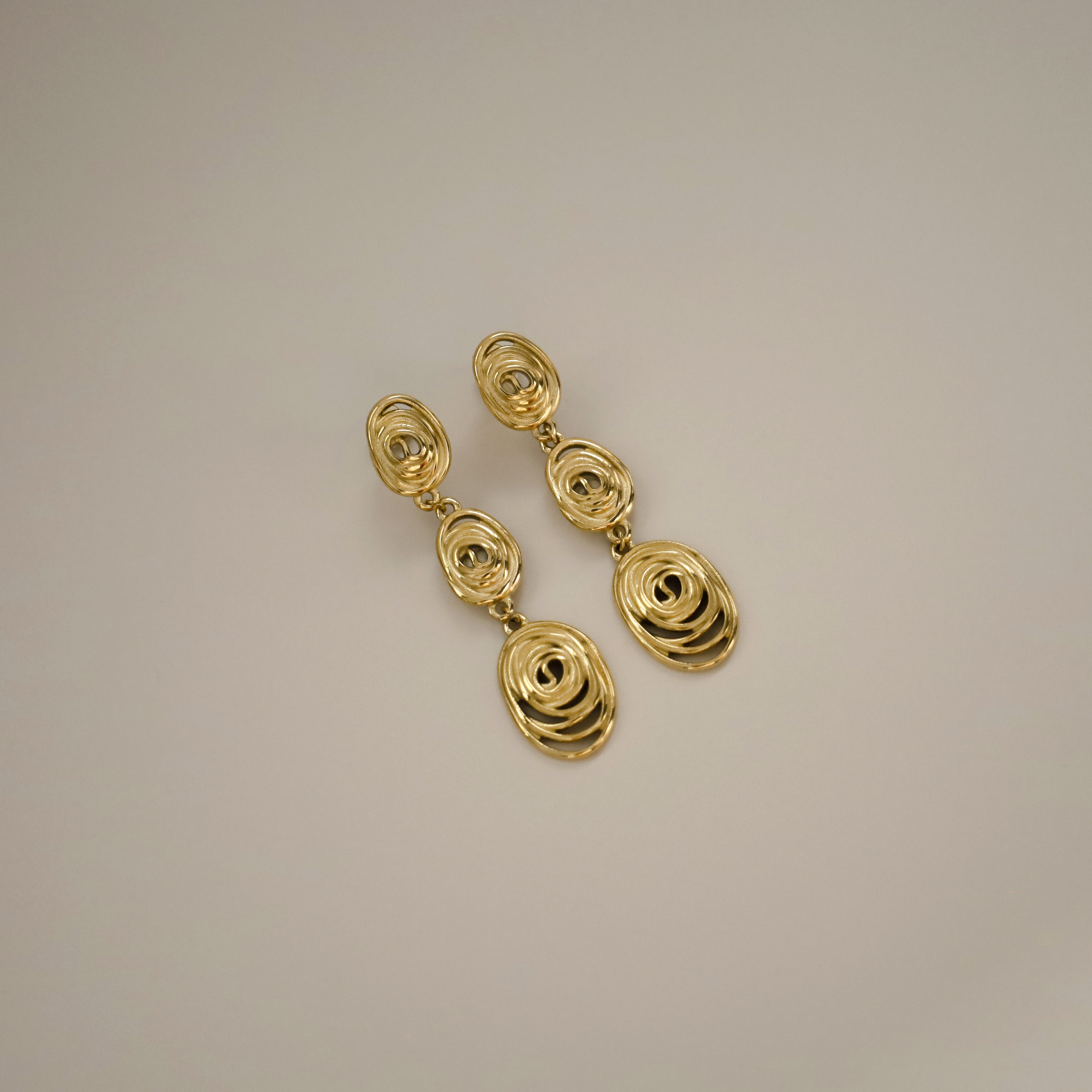 gold eydis earrings, three delicate layered spirals creating a cascading effect