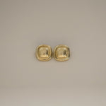 ezana earrings, gold rectangular earrings with puffy center in a scale design and smooth outer edge