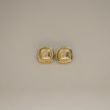 ezana earrings, gold rectangular earrings with puffy center in a scale design and smooth outer edge