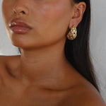 eztli earrings, gold woven texture in a teardrop shape